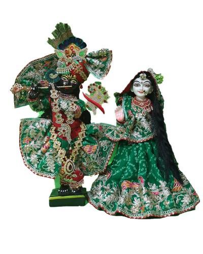 Beautifully Adorned Radha Krishna Statues In Heavy Embellished Green & Red Costumes For Festivals Celebrations