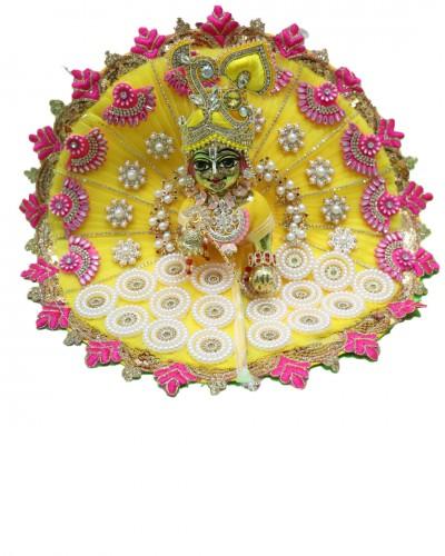 A contrast of yellow and magenta with all the accessories perfect for jnmashtami 