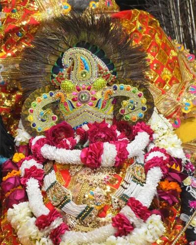 Radhaballav Ji Orange Poshak Set with Crystal Work and Floral Garland
