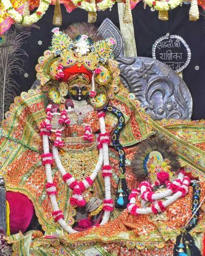 Radhaballav Ji Poshak Adorned with Elaborate Crown and Garlands