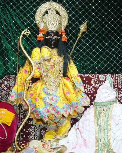Radhaballav Ji Poshak Featuring a Bright Yellow Dress and Sparkling Jewelry