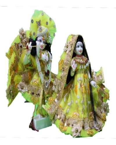 Vibrant Yellow Radha Krishna Idols Gold Embellished Attire